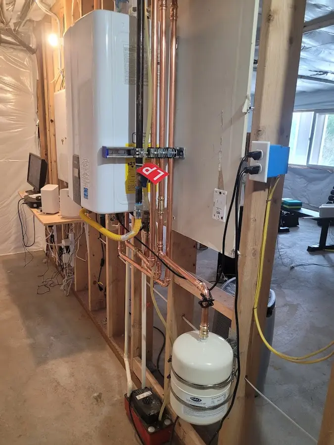 Licensed plumber repairing a kitchen sink in Tecumseh